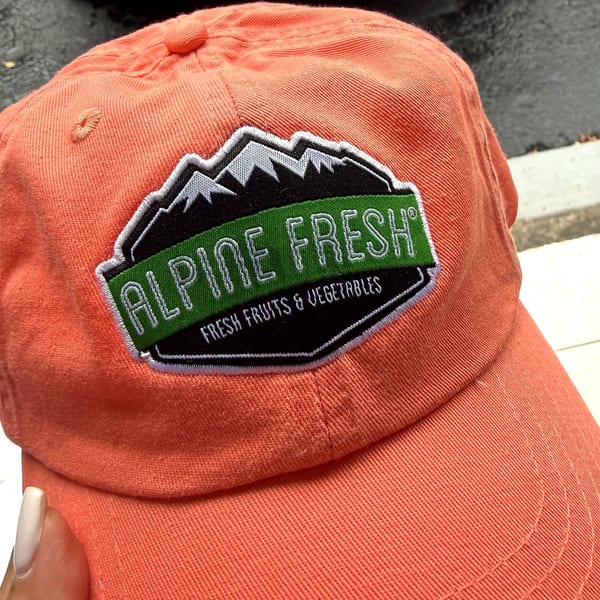 Coral baseball cap with Alpine Fresh logo — custom embroidery Miami